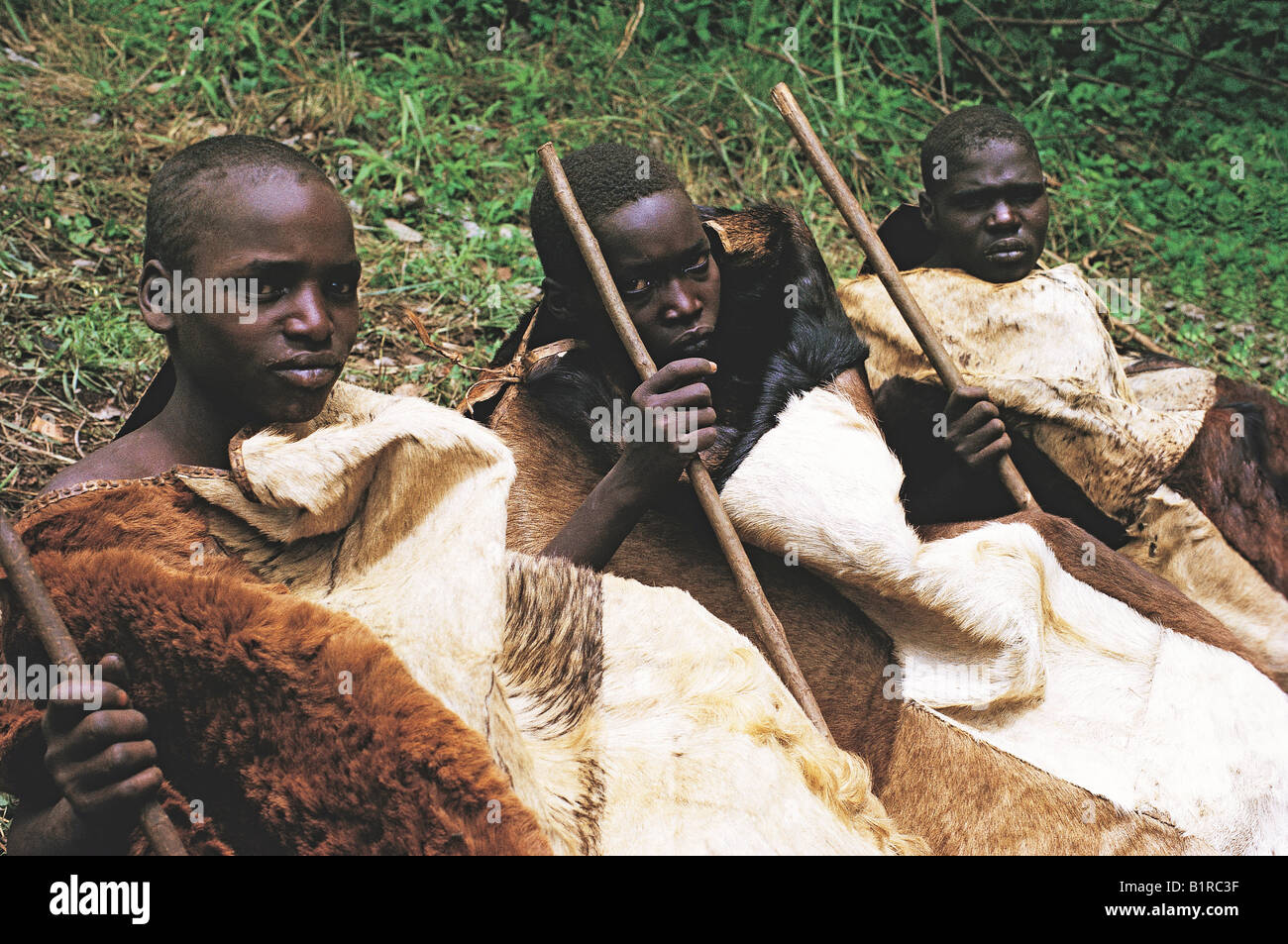 Three Nandi youths in seclusion after circumcision and rite of passage into manhood Kenya East Africa Stock Photo