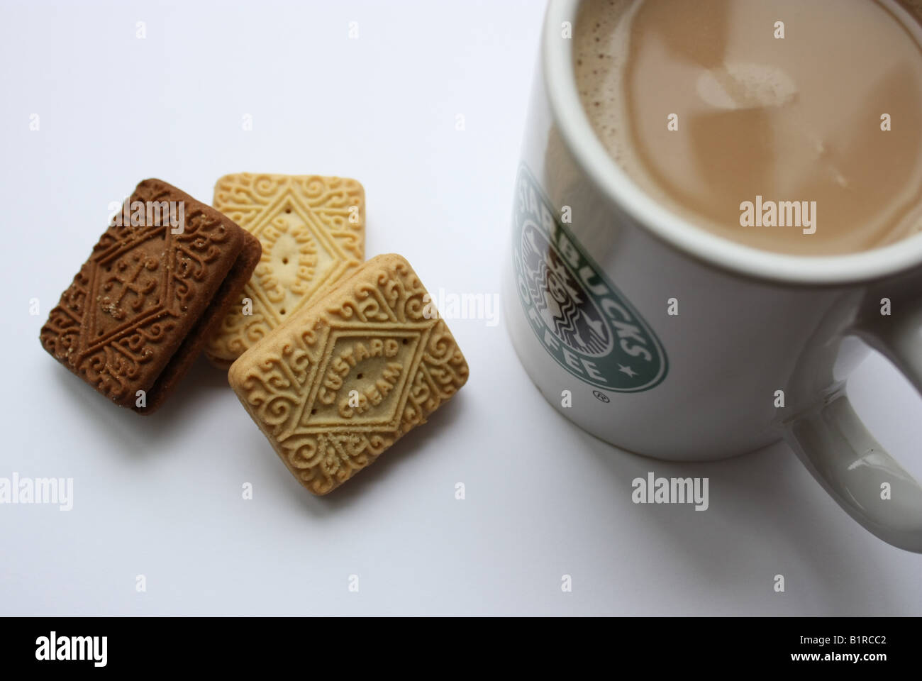 A cup of coffee with biscuits to dunk. Stock Photo
