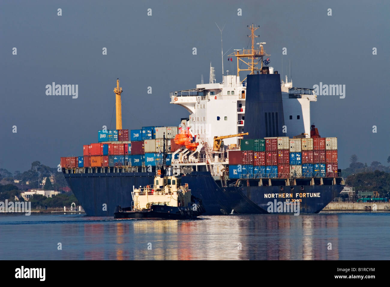 Shipping Industry / A Container Ship is outbound in the 'Port of Melbourne' Australia. Stock Photo