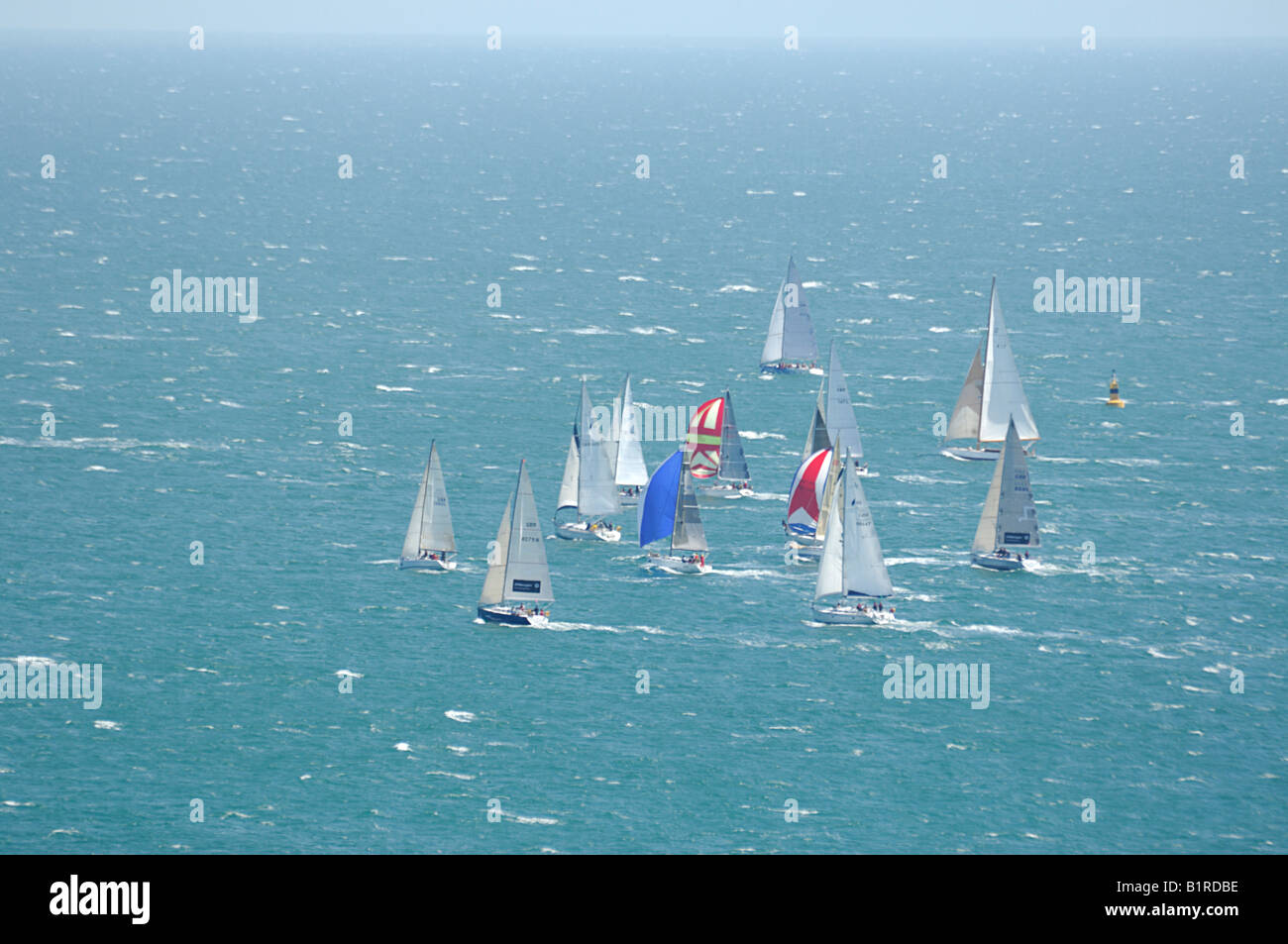 A tight cluster of Yachts racing during Round the Island Race on the Isle of Wight 2008 Stock Photo