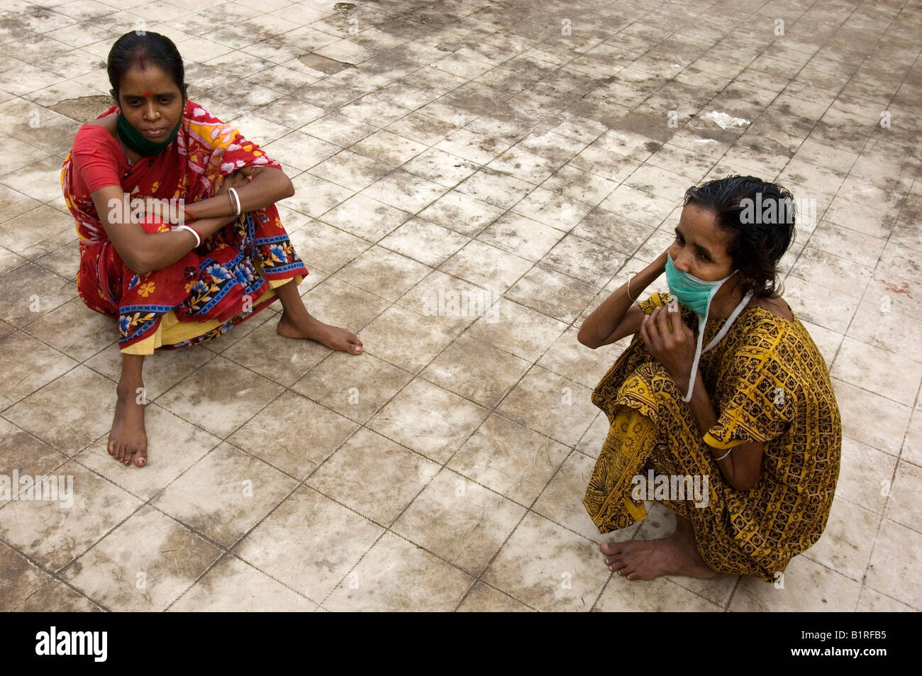 Multi-resistant tuberculosis patients Radha Devi, 30, left, and Najira Begum, 35, sitting on the roof terrace of the quarantine Stock Photo