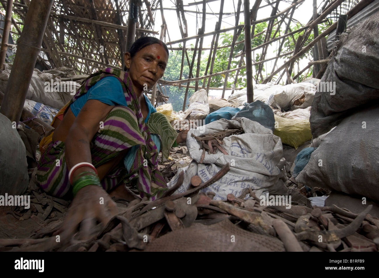 Almost the entire Slum of Topsia live from the sorting and recycling of garbage, women in this dilapidated hut are sorting the  Stock Photo