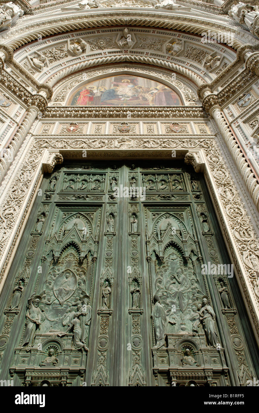 Bronze door of main entrance to the Cathedral of Santa Maria del Fiore or Duomo di Firenze, Florence, UNESCO World Heritage Sit Stock Photo