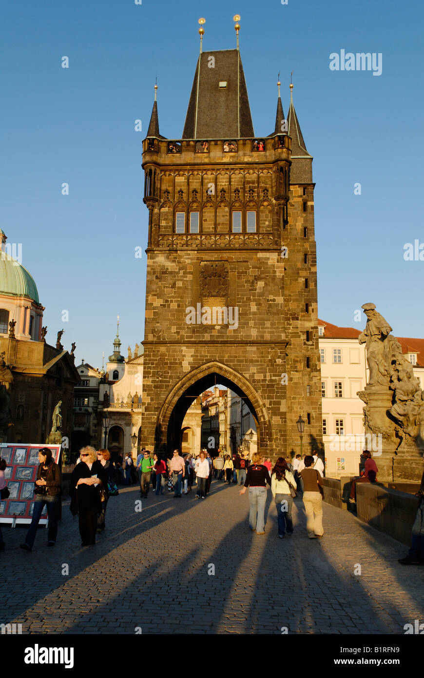 Tourists on Charles Bridge with the historic city centre Bridge Tower, UNESCO World Heritage Site, Prague, Czech Republic, Czec Stock Photo