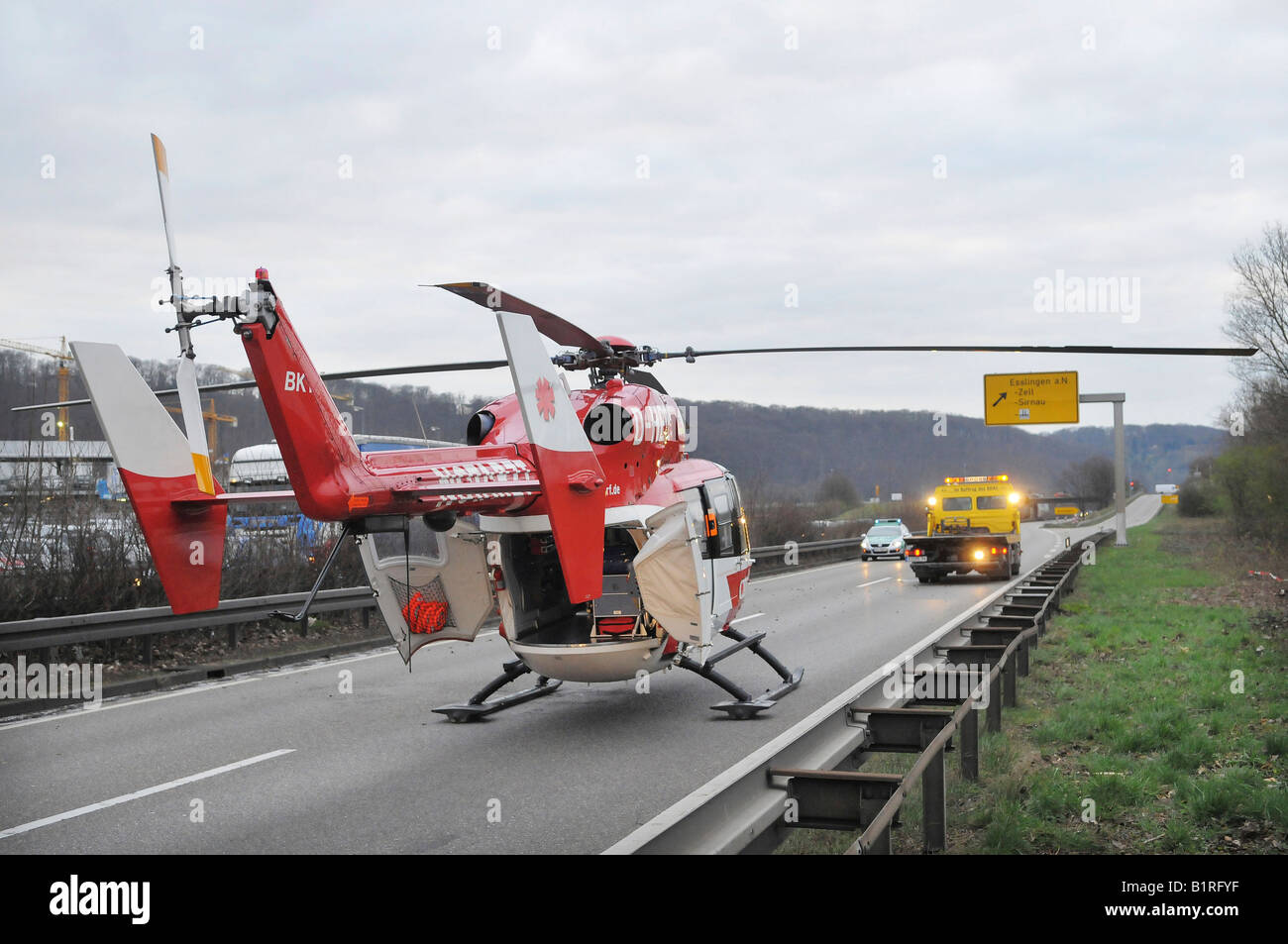 The DRF-Rettungshubschrauber or rescue helicopter of the German Air Rescue at the scene of an accident on the B313 between the  Stock Photo