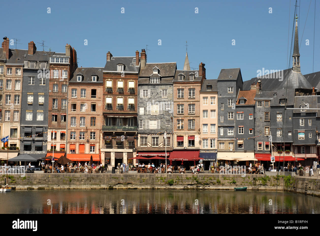 Waterfront buildings lining the harbor,  Le Vieux Bassin, Honfleur, France Stock Photo