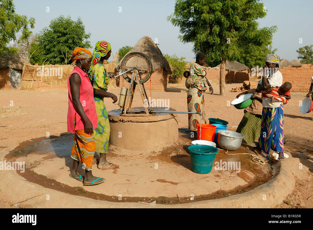 Women getting water from the well, Pakete, Cameroon, Africa Stock Photo