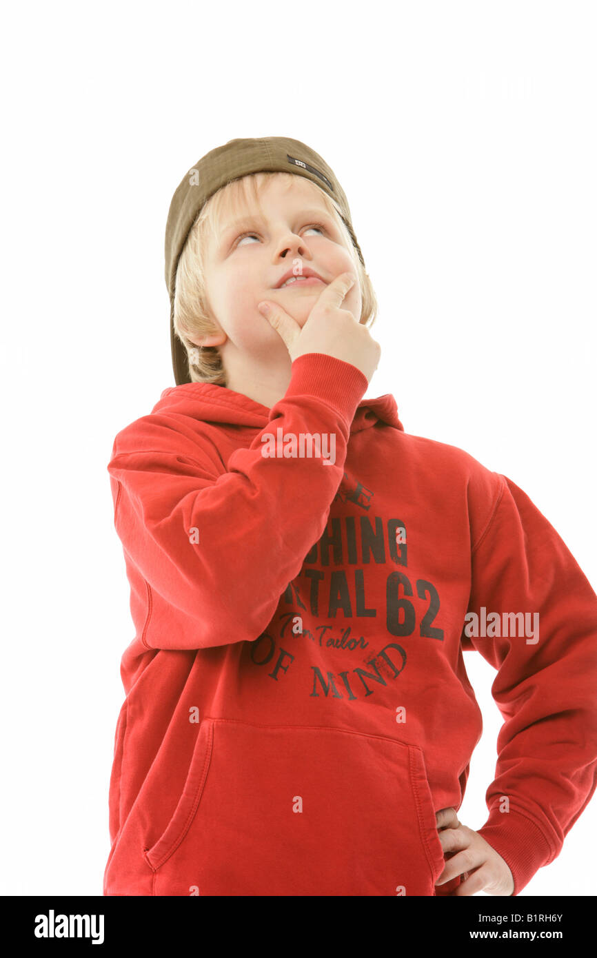 9yearold boy wearing a cap and a red sweater Stock Photo Alamy