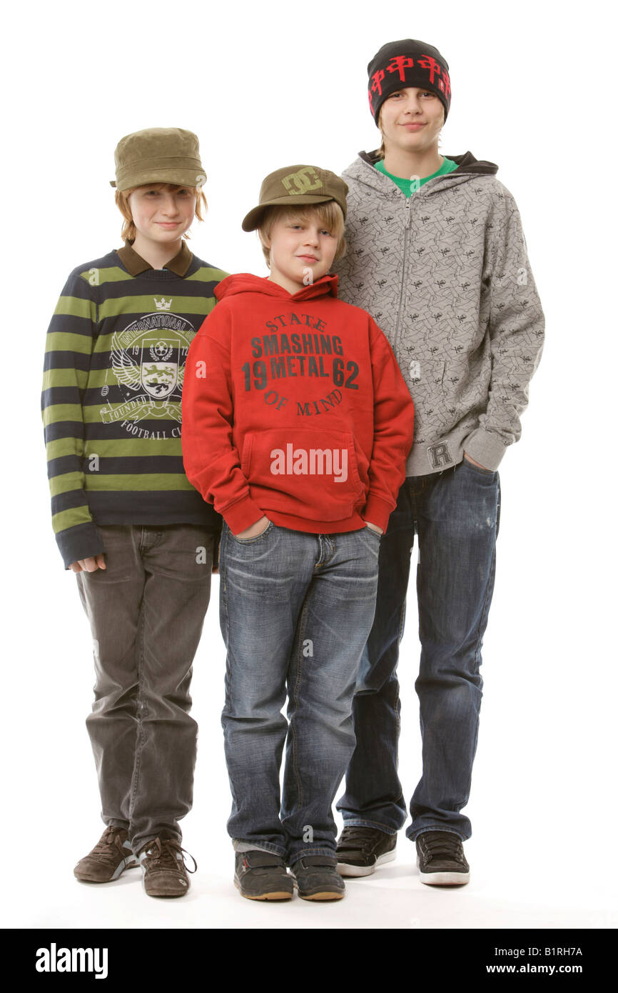 3 boys between the ages of 9 and 13, wearing caps Stock Photo