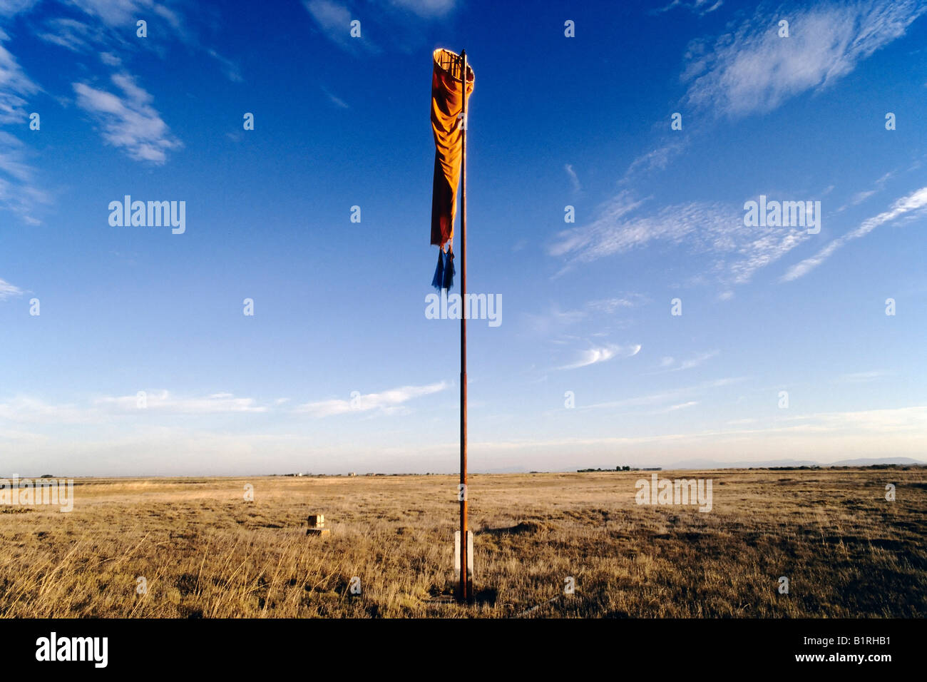 Limp windsock hanging from a pole in the veld of the Little Karoo in Western Cape, South Africa Stock Photo