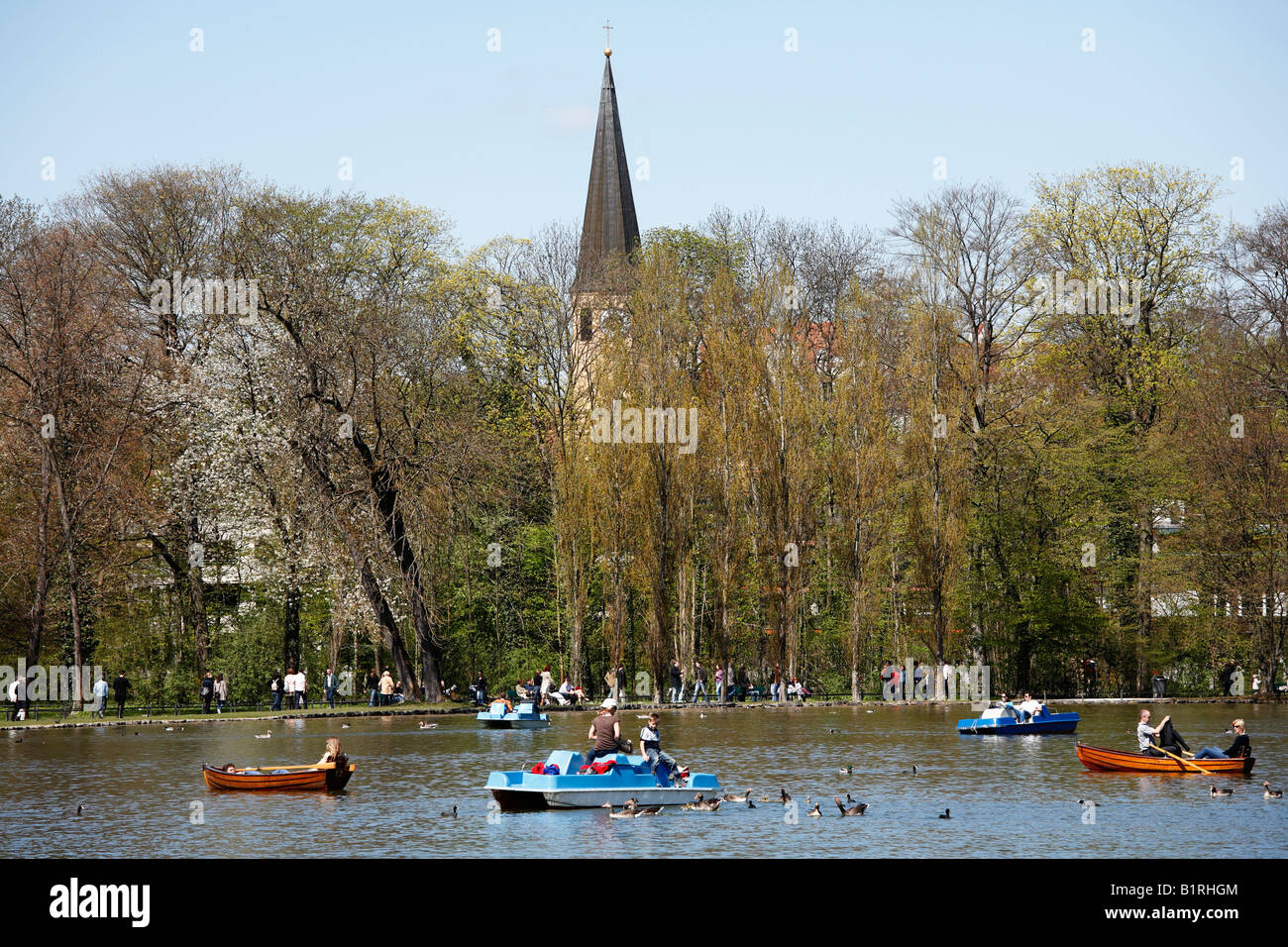 St. Sylverster Church in Schwabing and boats in the Kleinhesseloher See, English Garden lake, Munich, Bavaria, Germany, Europe Stock Photo