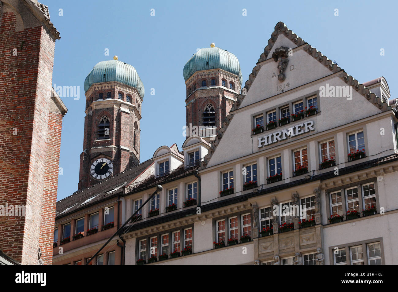 Towers of the Frauenkirche Church, Haus Hirmer, Kaufingerstrasse 28, historic centre of Munich, Upper Bavaria, Germany, Europe Stock Photo