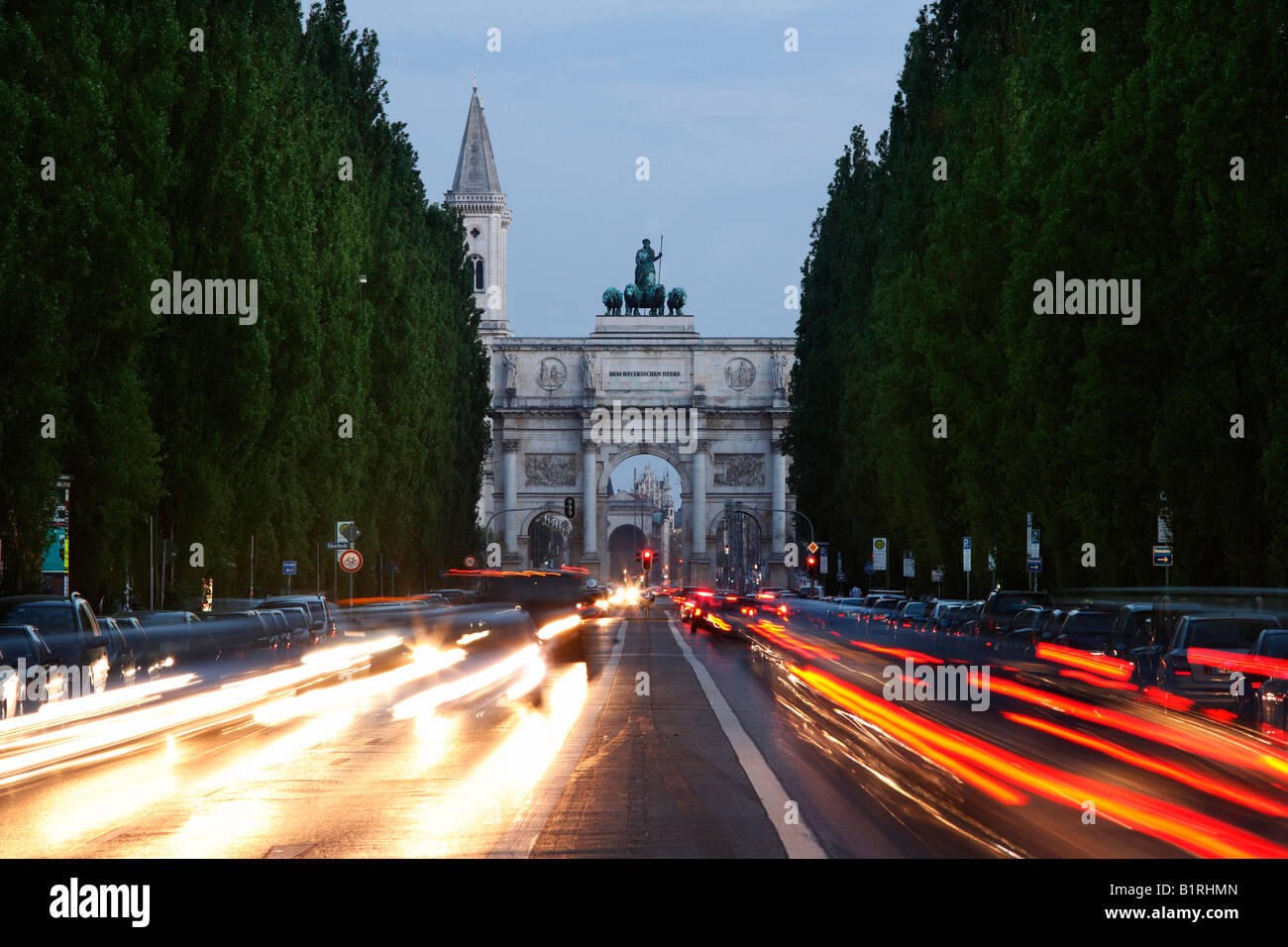 Siegestor, Victory Gate, with light trails from traffic in Leopoldstrasse Street, Munich, Upper Bavaria, Germany, Europe Stock Photo