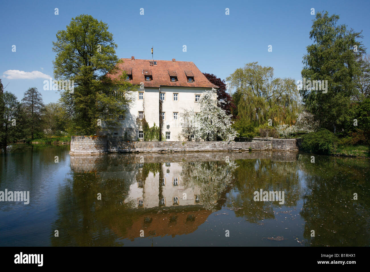 Wasserschloss Kleinbardorf Castle with a moat, Gemeinde Sulzfeld, Hassberge, Rhoen-Grabfeld, Lower Franconia, Bavaria, Germany, Stock Photo