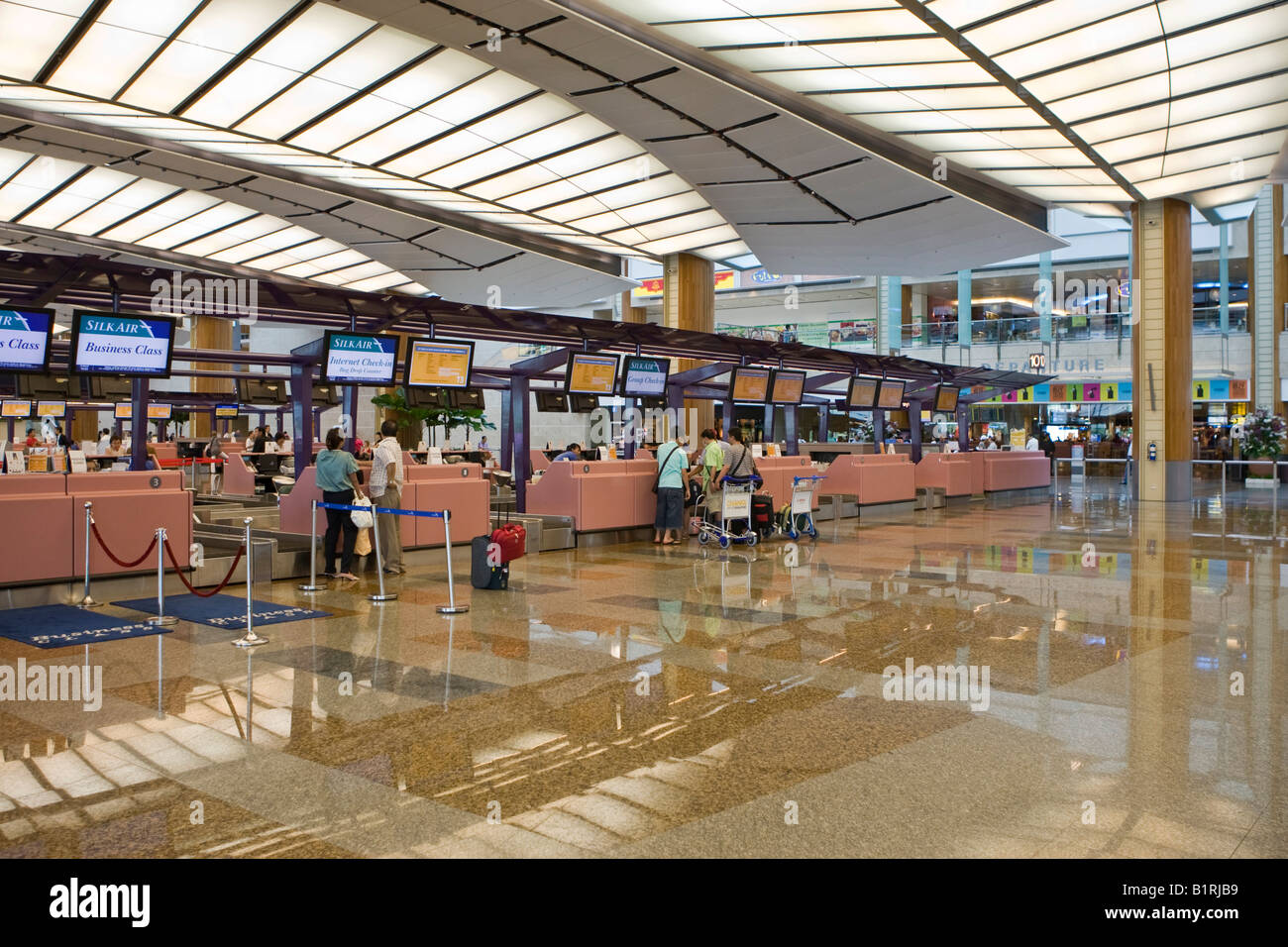 Departure hall and check-in counters at Changi Airport, Singapore, Southeast Asia Stock Photo