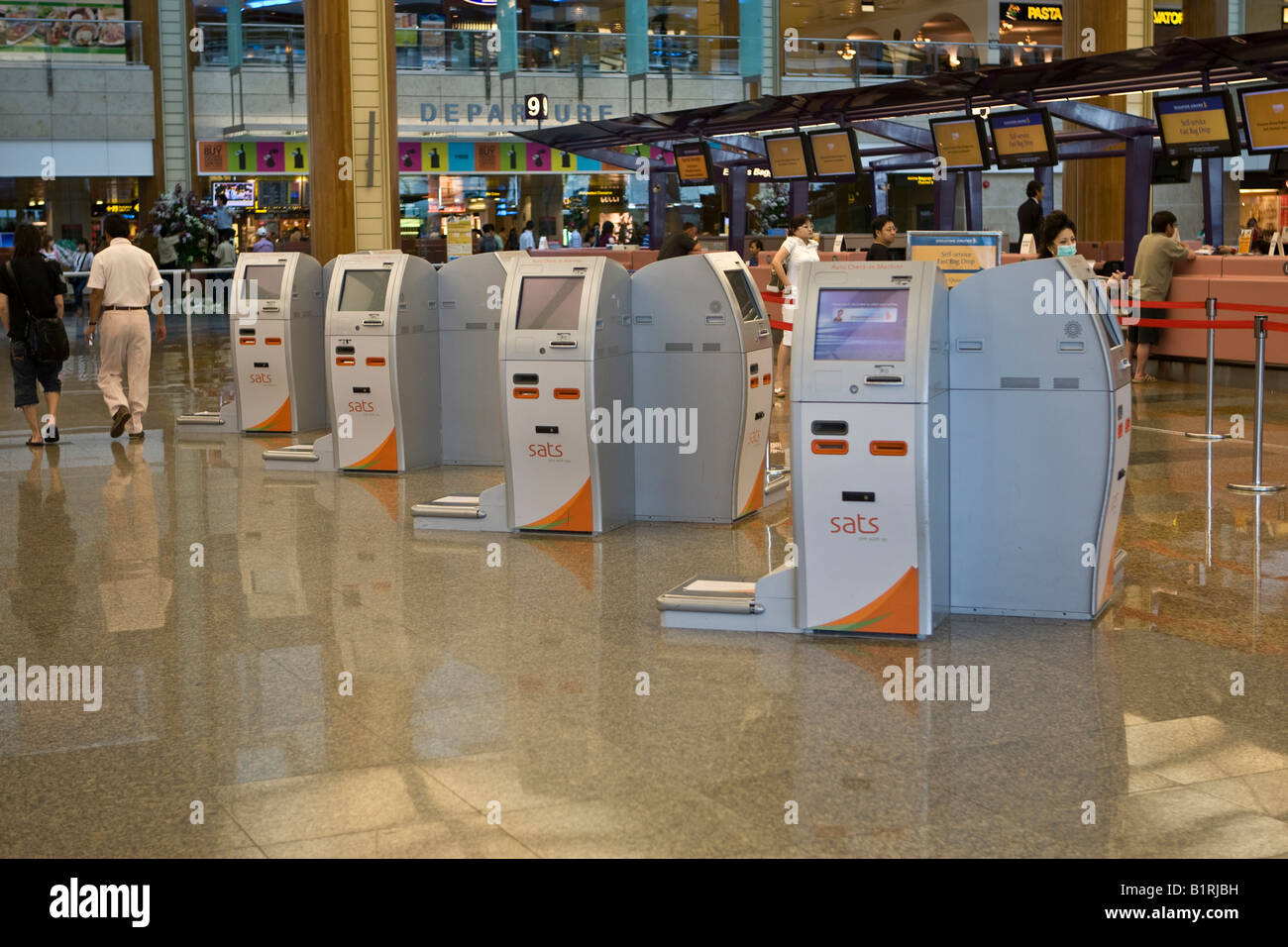 Self check-in terminals in the departures hall of Changi Airport, Singapore, Southeast Asia Stock Photo