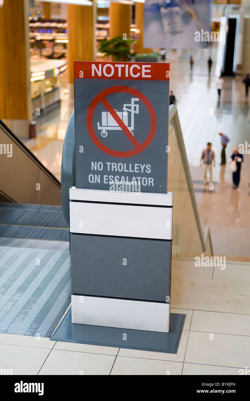 Notice, No Trolleys on Escalator, in the Departures Hall of Changi Airport, Singapore, Southeast Asia Stock Photo