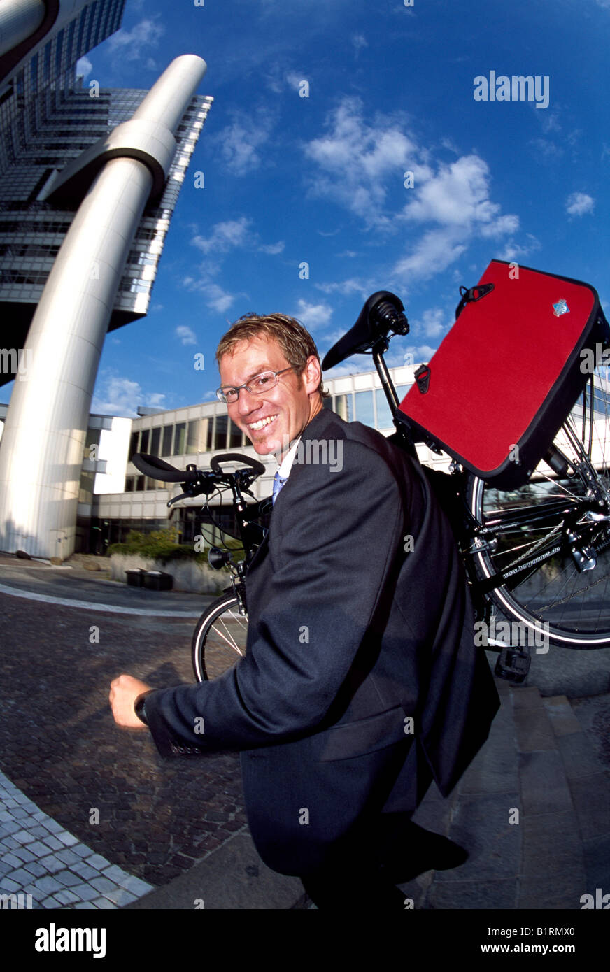 Businessman, biker, Hypo-Haus, Bogenhausen, Munich, Bavaria, Germany Stock Photo