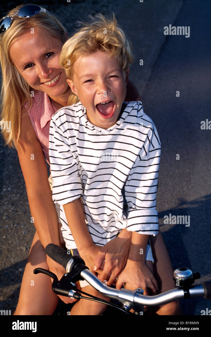 Mother and son on a bike Stock Photo