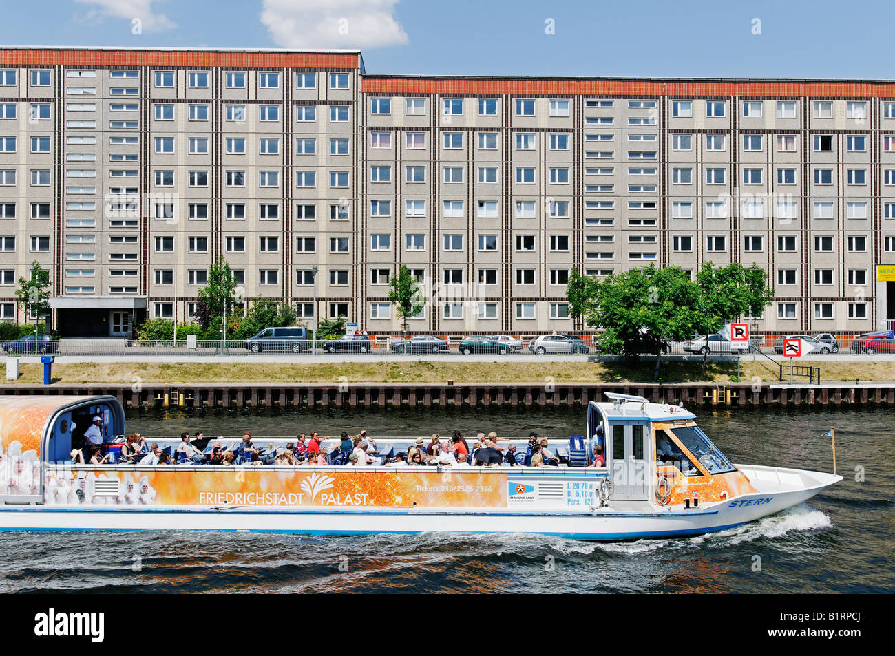 Tourist ship on the Spree River in front of buildings constructed of large, prefabricated concrete slabs, Berlin-Mitte, Berlin, Stock Photo