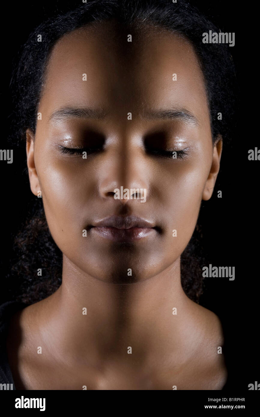 Portrait of a young dark-skinned woman with closed eyes Stock Photo