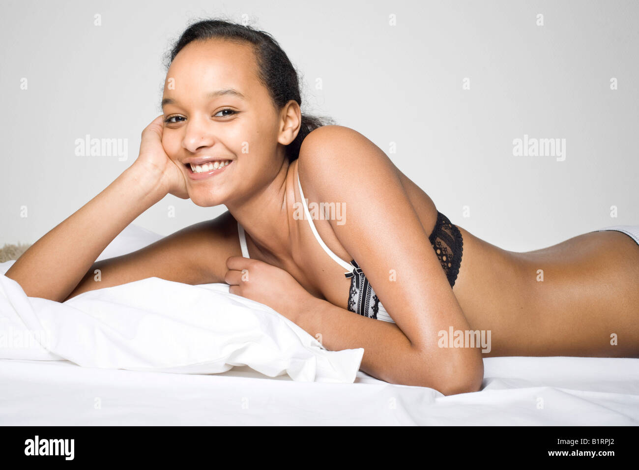 Girl lying in bed with bra hi-res stock photography and images - Alamy