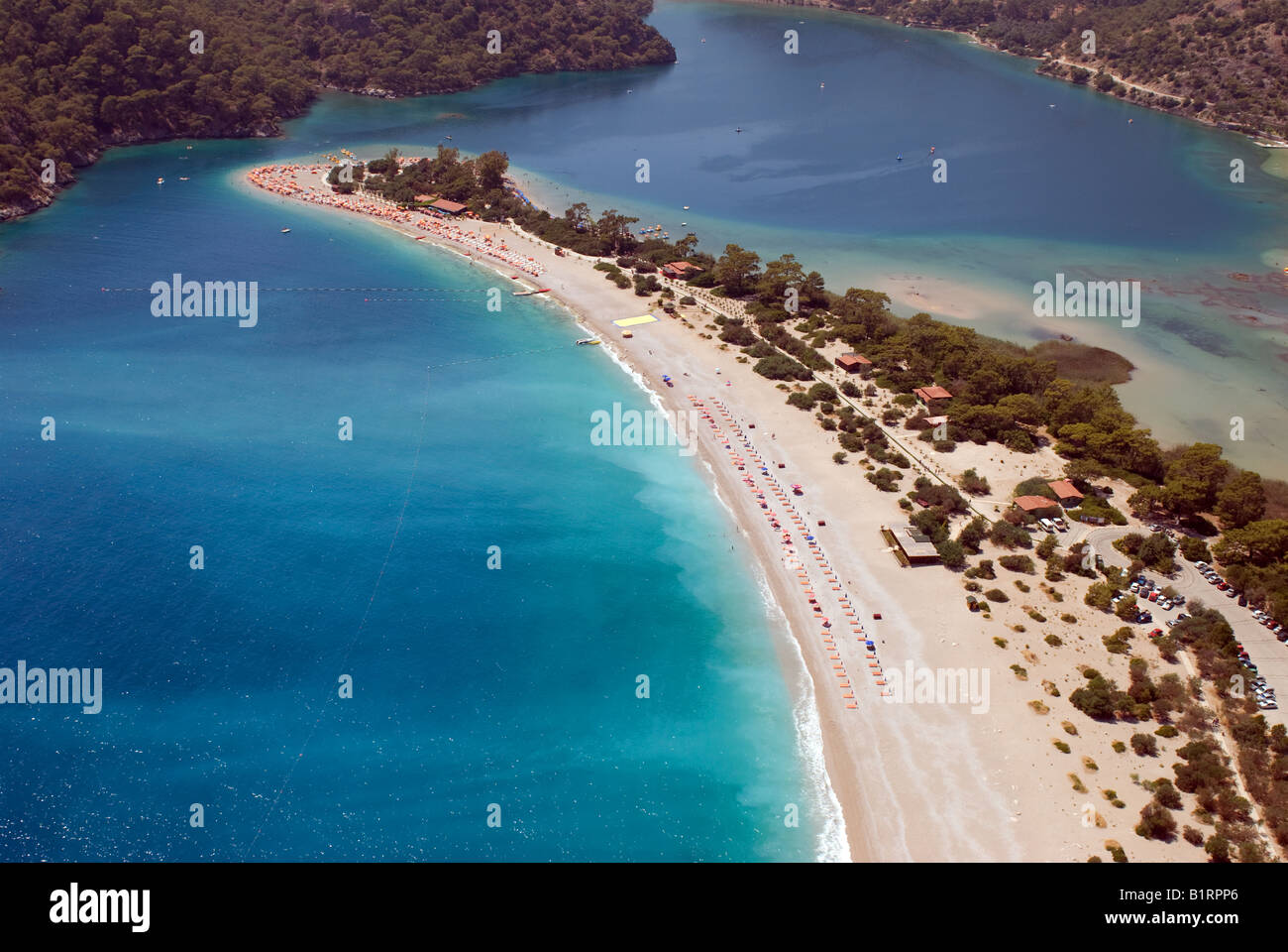 Arial view of Oludeniz beach in Mugla, Fethiye Turkey from a tandem paraglider who was going to land on Olu Deniz beach Stock Photo