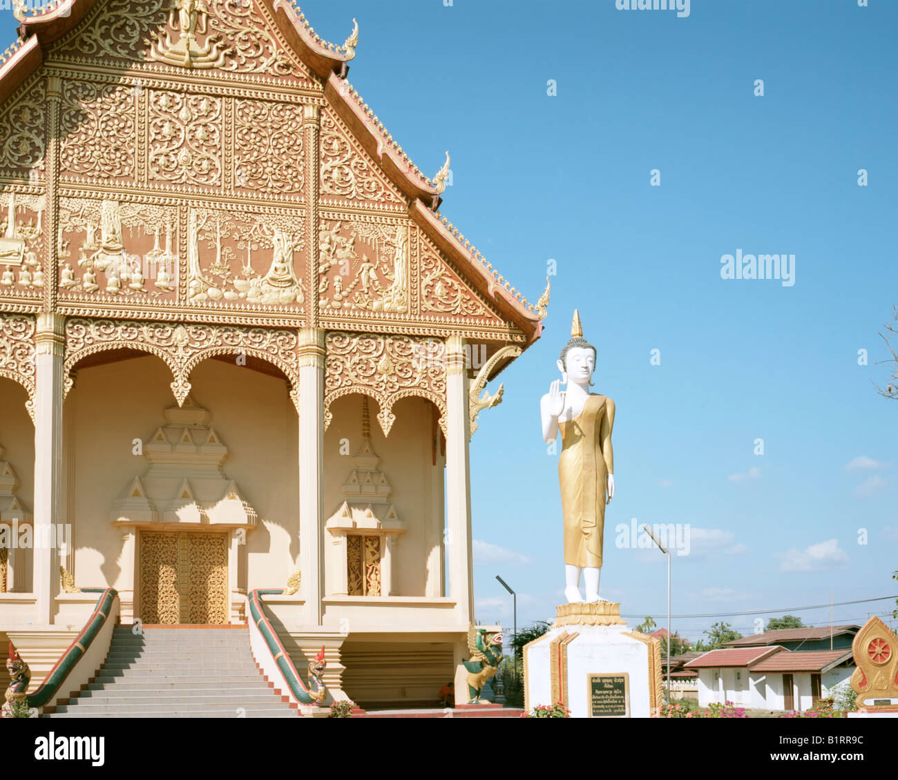 A Buddha guarding the temple at the Pha That Luang Stock Photo