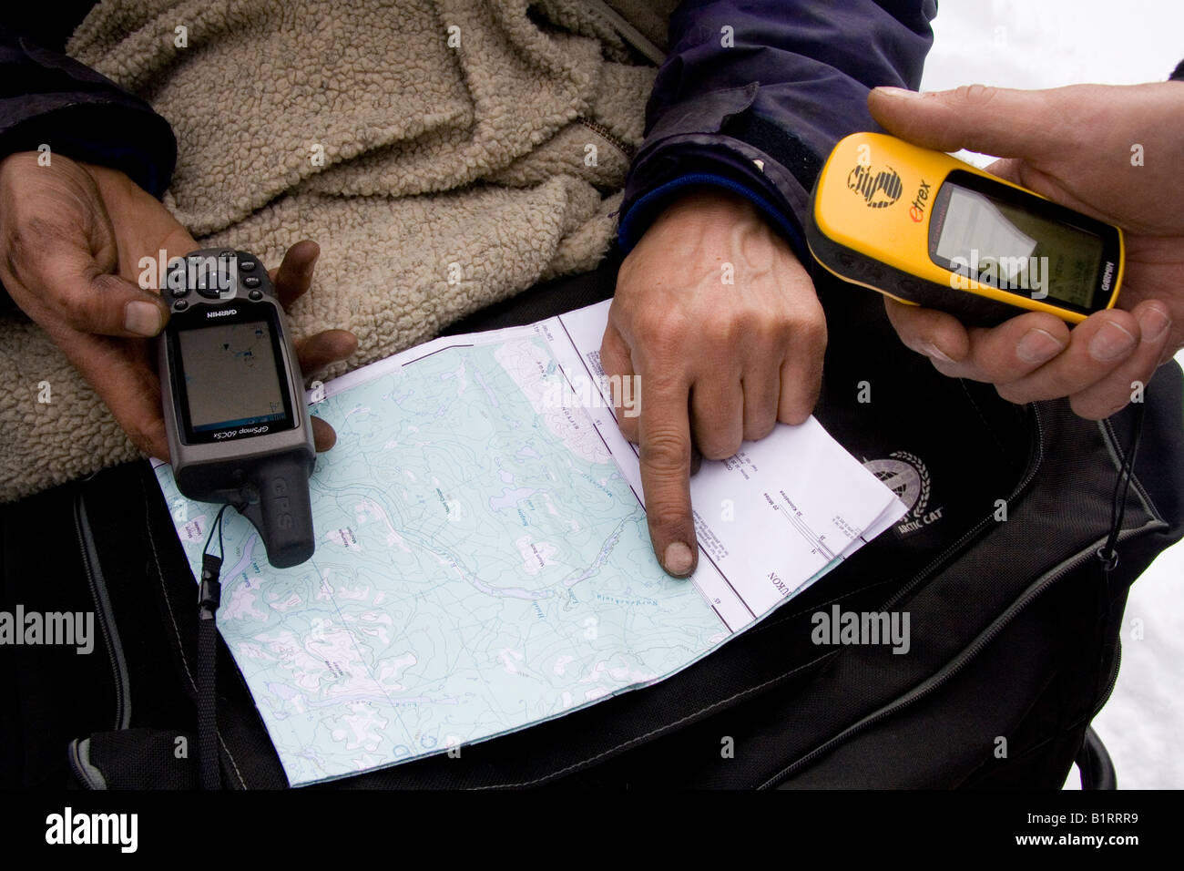 Navigation using a Garmin GPS device and a map Stock Photo - Alamy