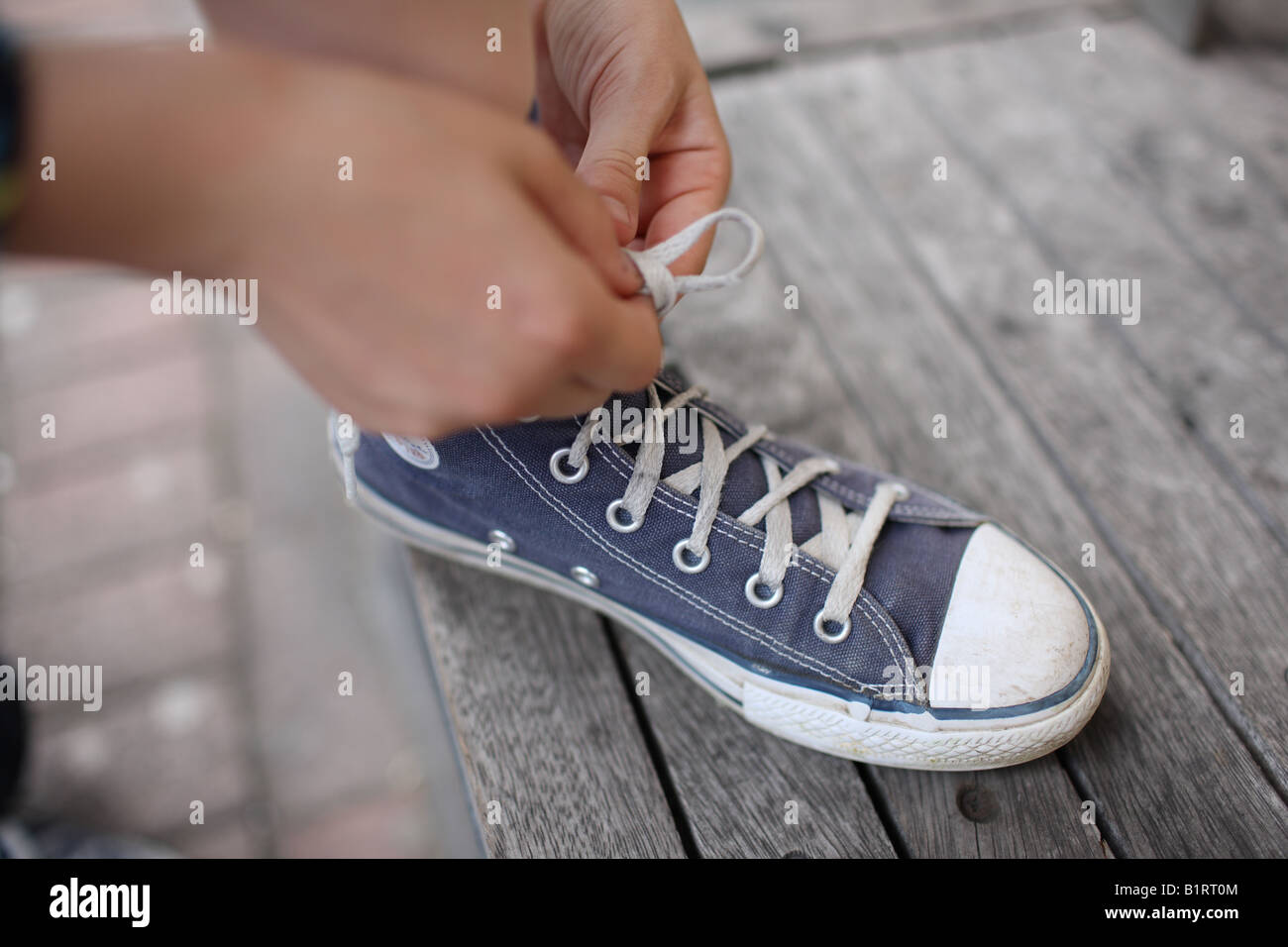Learning to tie shoe laces Stock Photo Alamy