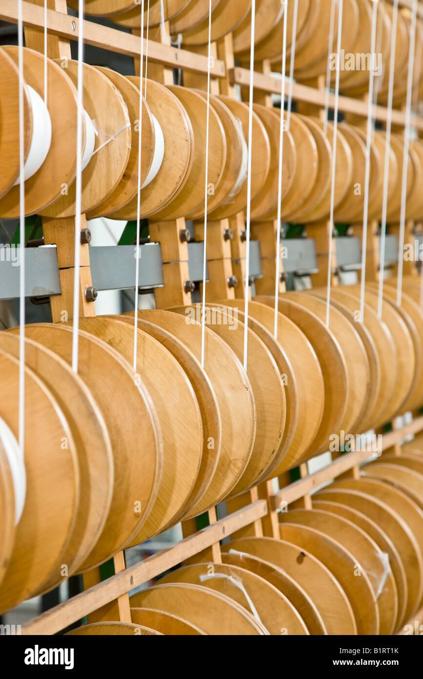 Wall of yarn spools Stock Photo - Alamy