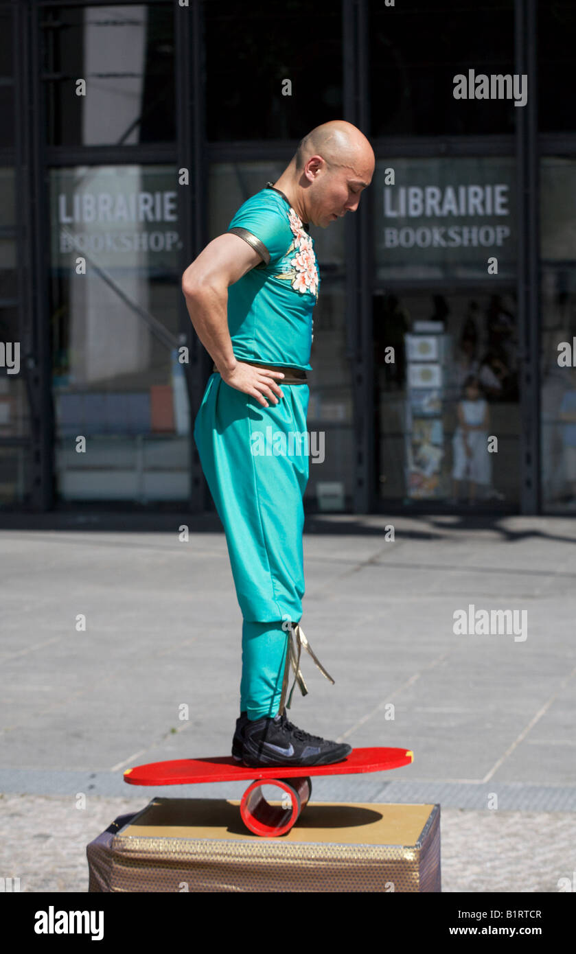 Oriental balancing act in front of the Pompidou Centre Paris France 2008 Stock Photo