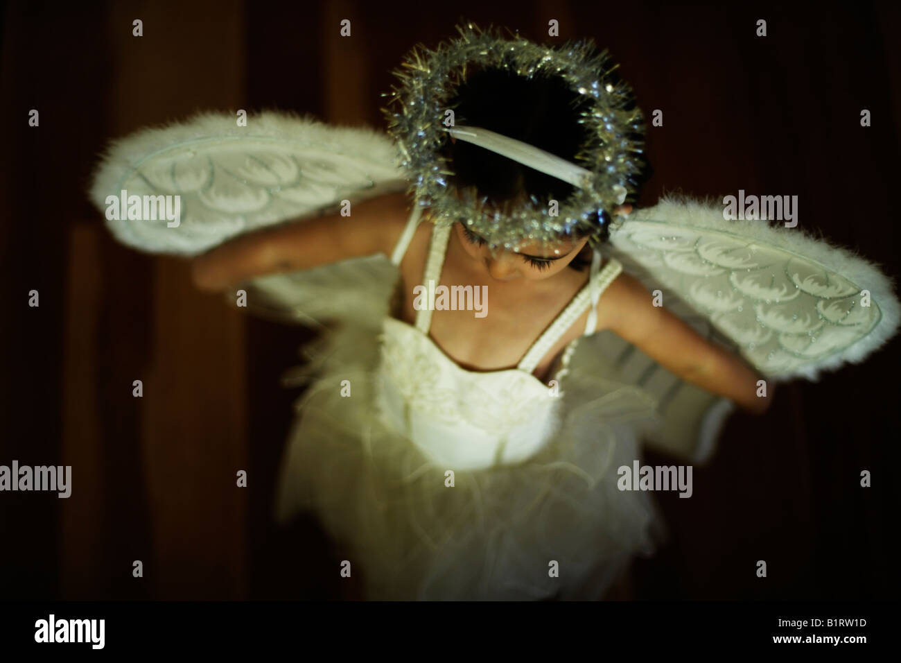 Girl aged four in angel costume Stock Photo