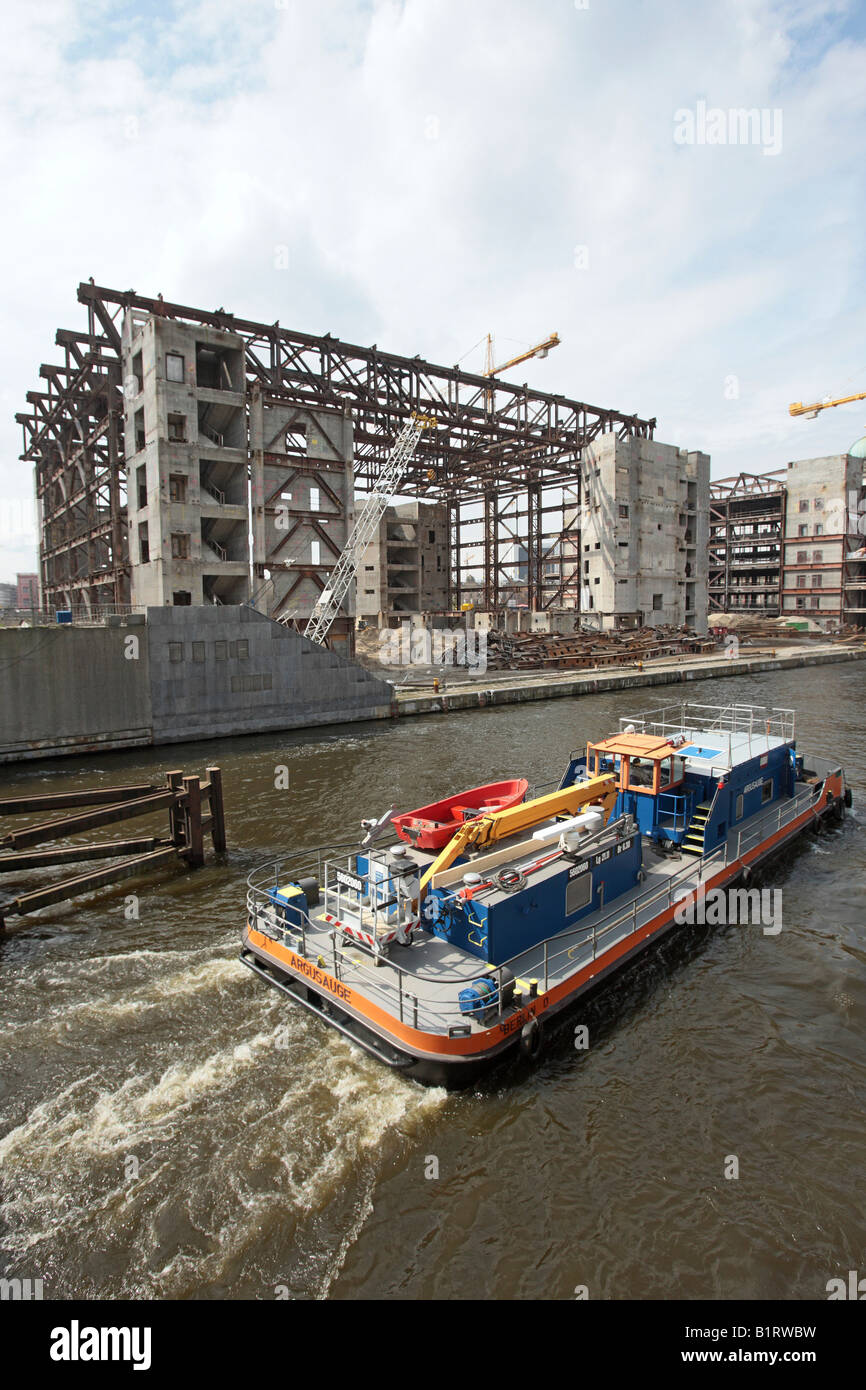 Lifting crane ship on the Spree River at the Palace of the Republic, Palast der Republik building site in central Berlin, Germa Stock Photo