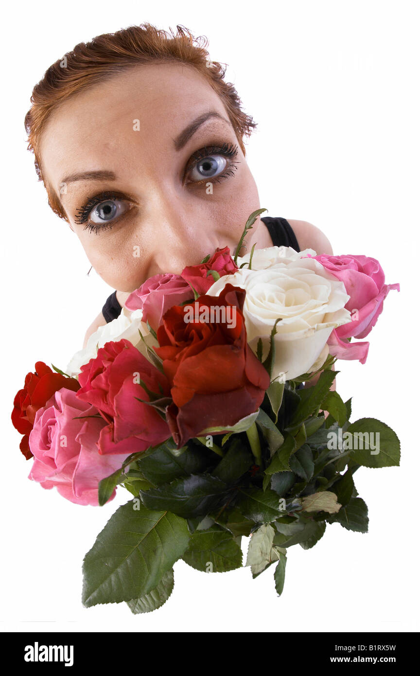 Woman holding a bouquet of flowers, fisheye lens Stock Photo