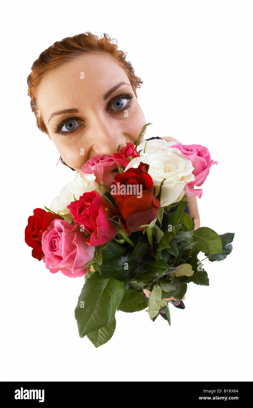 Woman holding a bouquet of flowers, fish-eye lens Stock Photo