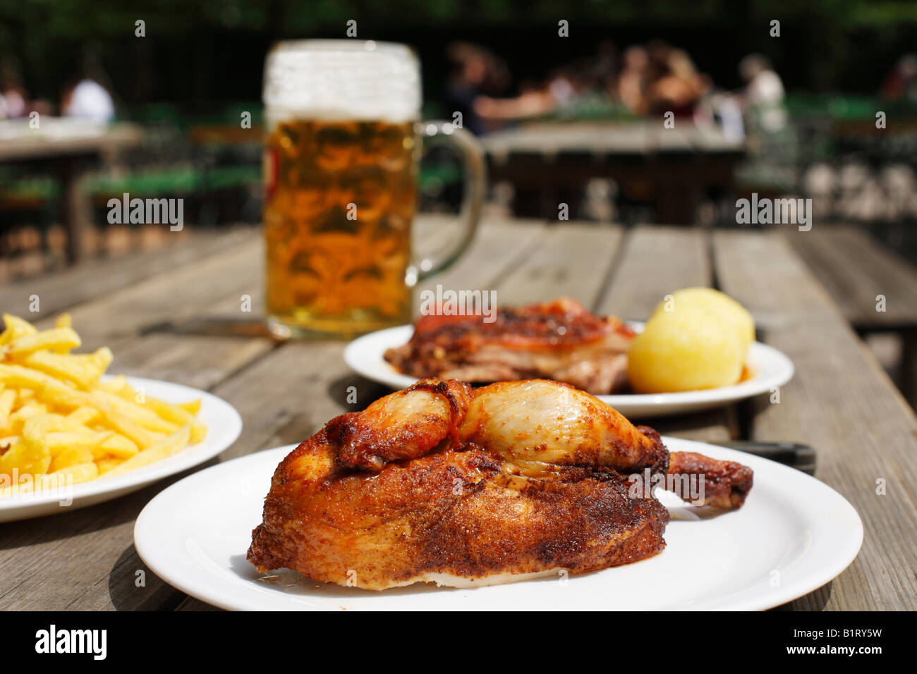 Half a roast chicken served in a beer garden in Taxisgarten, Munich, Bavaria, Germany, Europe Stock Photo