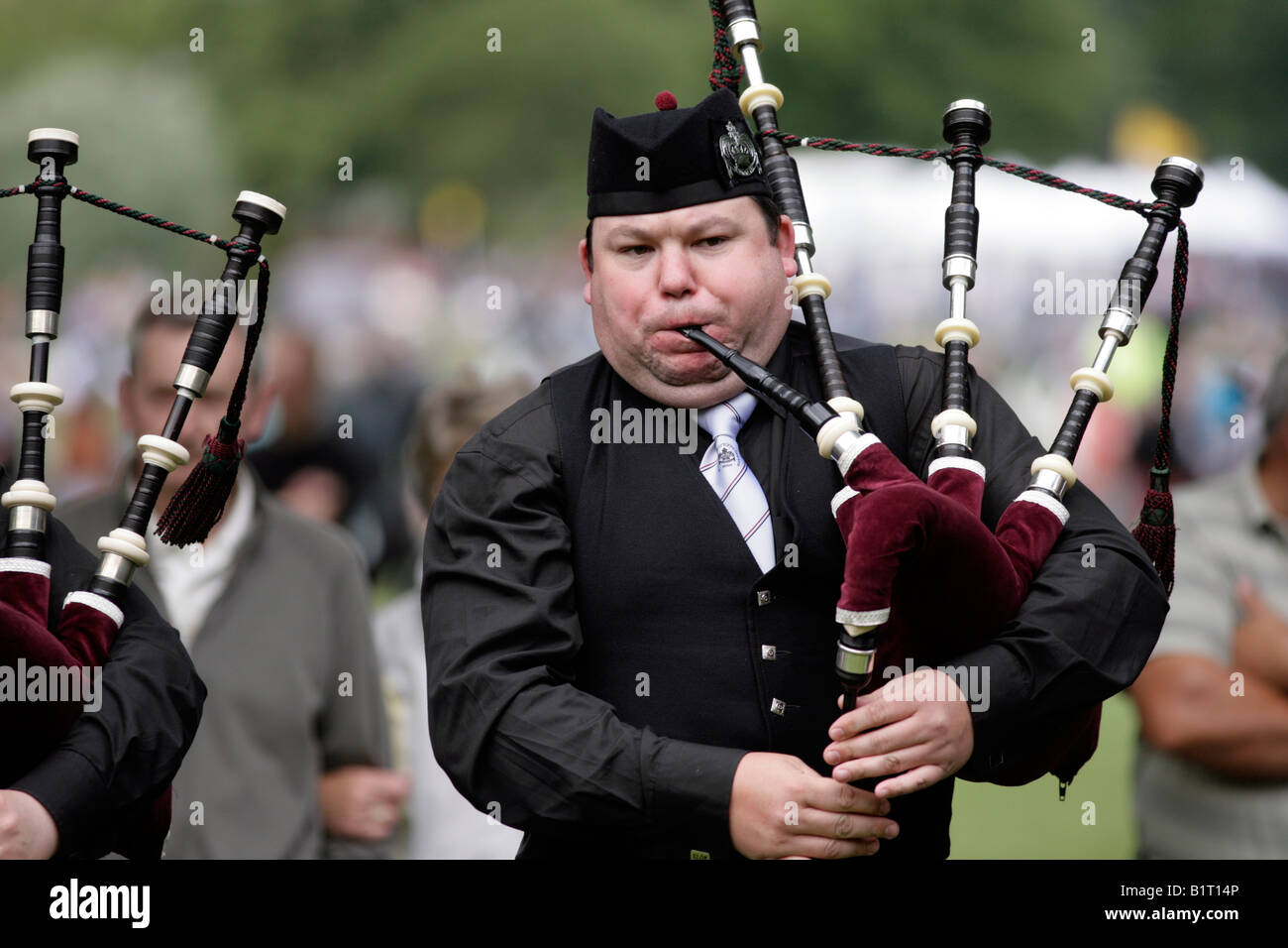 A man playing the bagpipes at the National Pipe Band Championships in Birmingham in 2008 Stock Photo