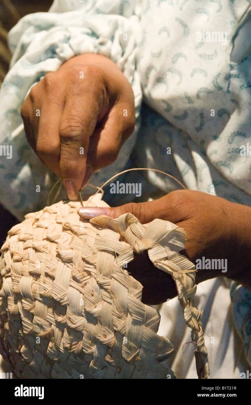 Woman weaves a basket hat, Vermilionville, Lafayette, Louisiana. Stock Photo