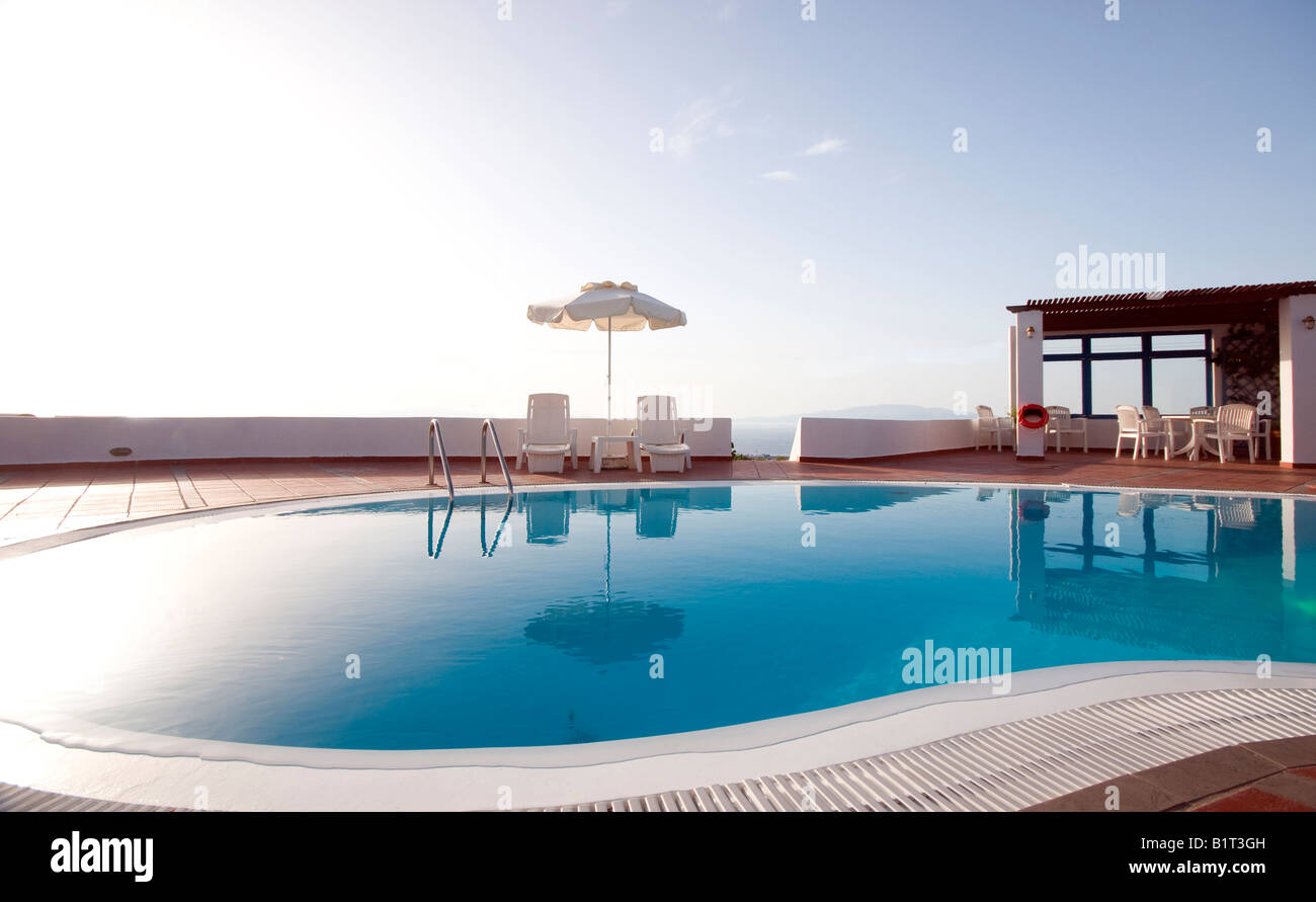 swimming pool with mediterranean sea view oia ia santorini thira greek cyclades islands greece Stock Photo