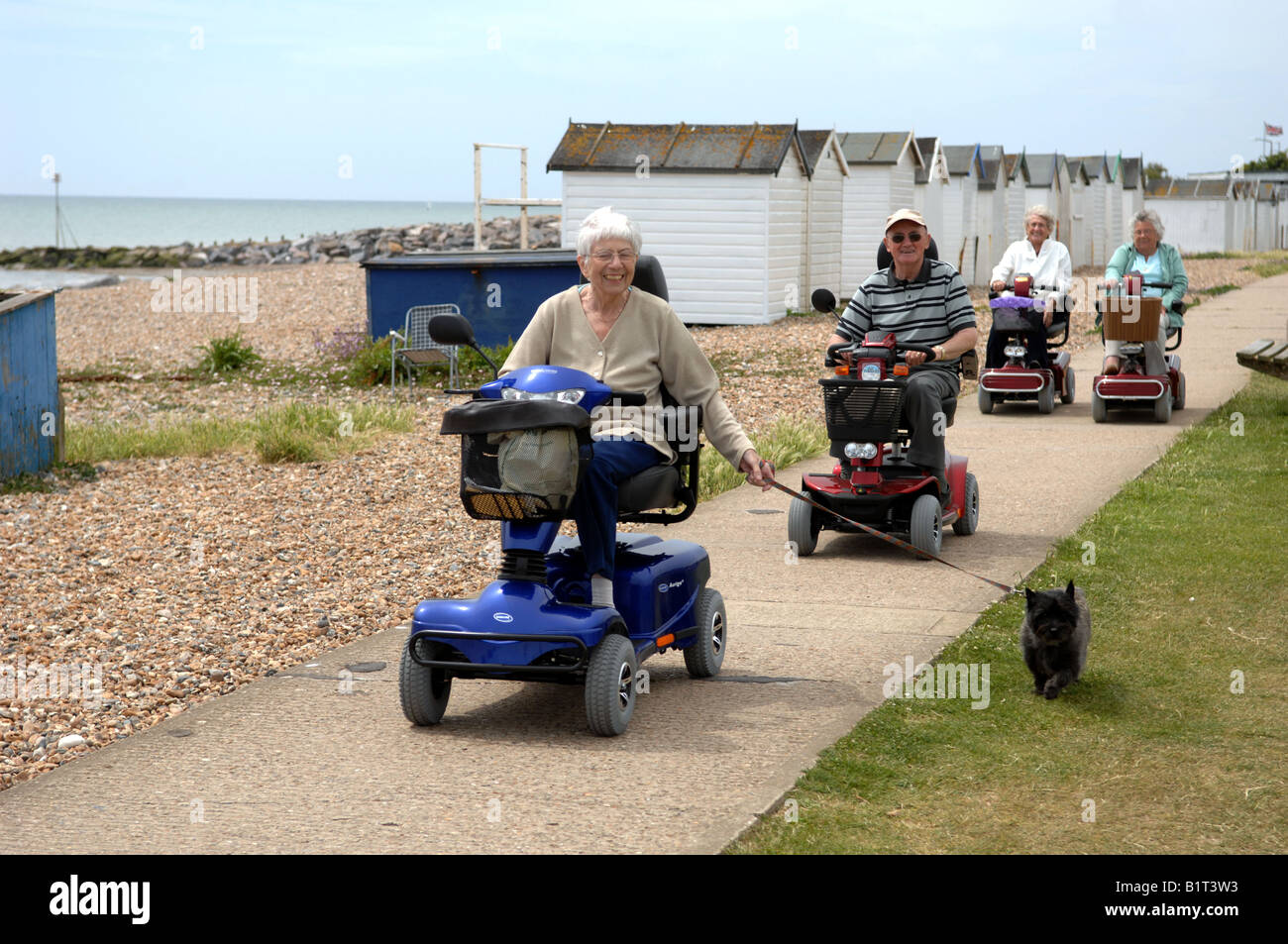 Pensioners out on their mobility buggies along the seafront at Goring near Worthing UK Stock Photo