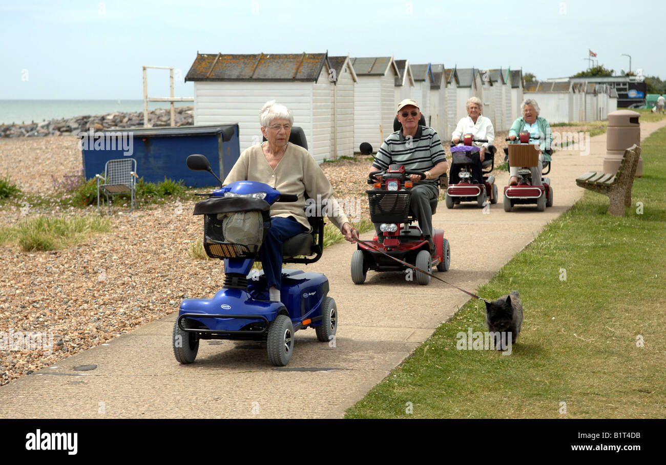Pensioners out on their mobility buggies along the seafront at Goring near Worthing Sussex UK Stock Photo