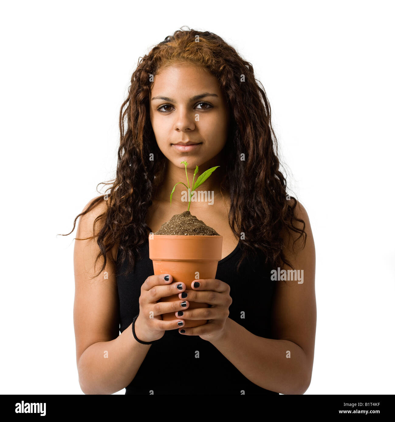 A girl holds a potted plant Stock Photo - Alamy
