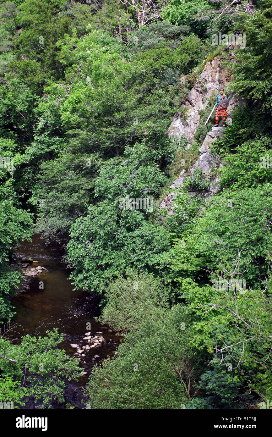 Statue of Scottish character Rob Roy McGregor over the Culter Burn at Peterculter, Aberdeenshire, Scotland, UK Stock Photo