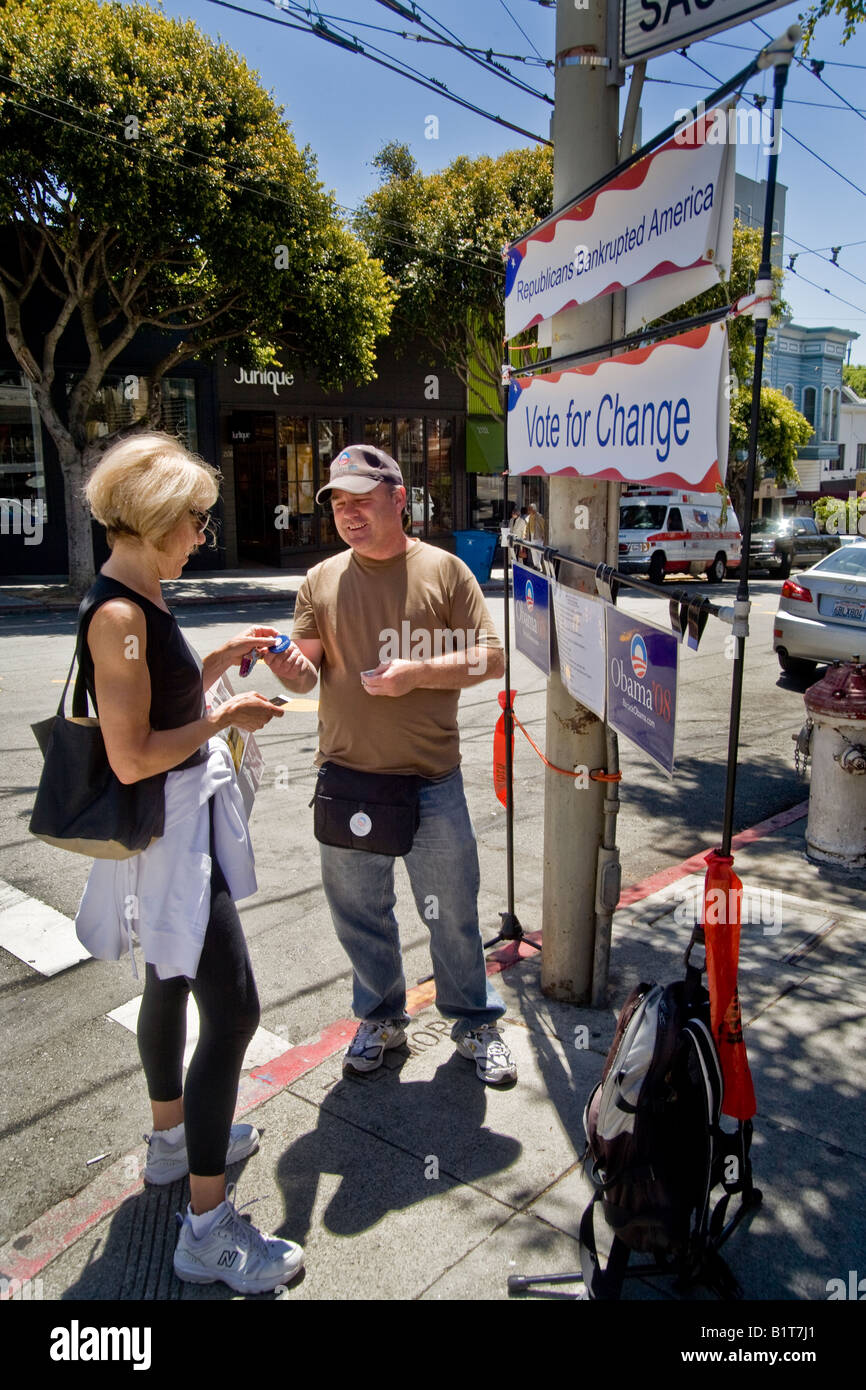 A volunteer Barak Obama Presidential campaign worker mans a portable sign on Fillmore Street in San Francisco Stock Photo