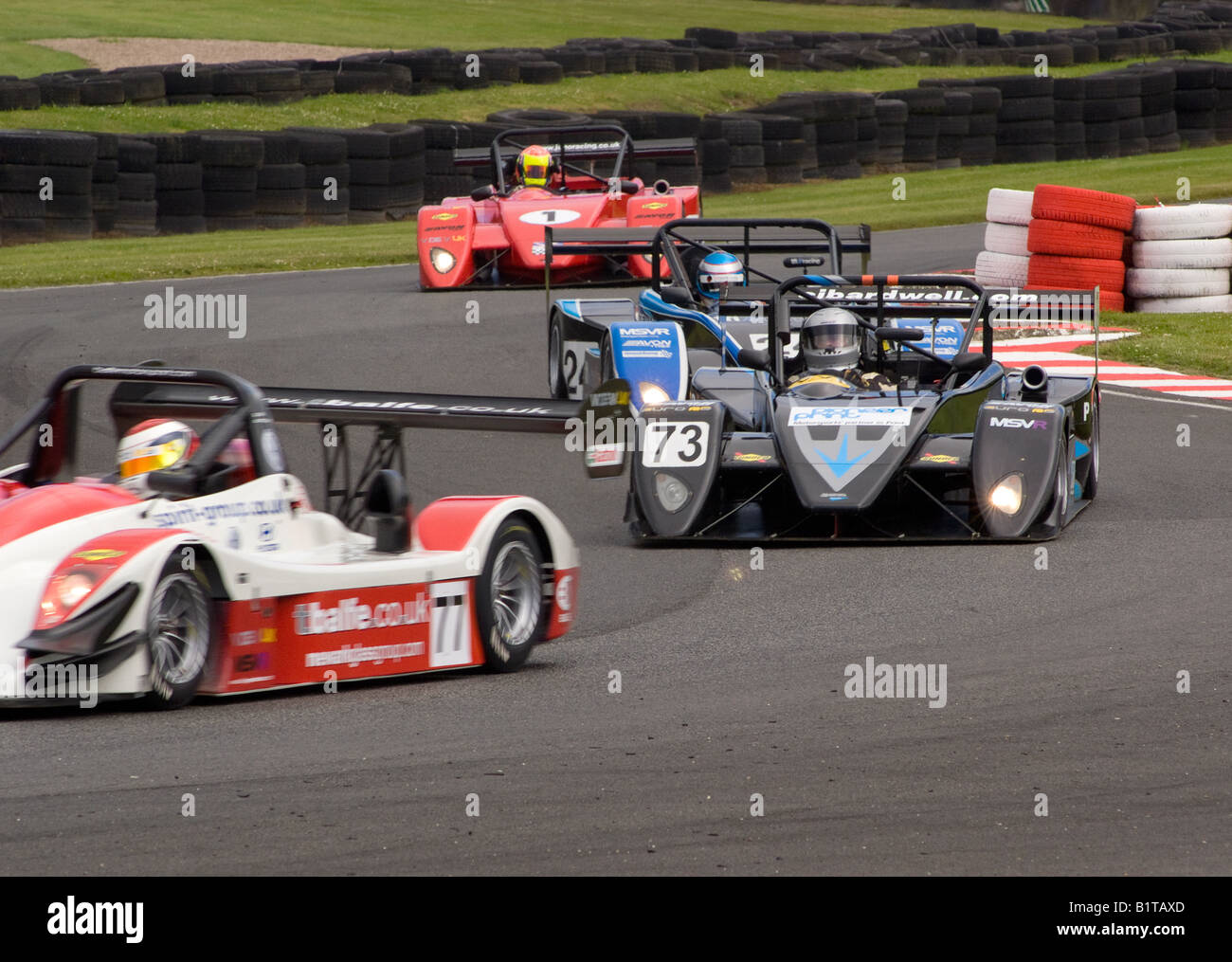 Norma M20f and Three Juno SSE V de V UK Sports Racing Cars in Brittens Corner at Oulton Park Motor Racing Circuit Cheshire UK Stock Photo