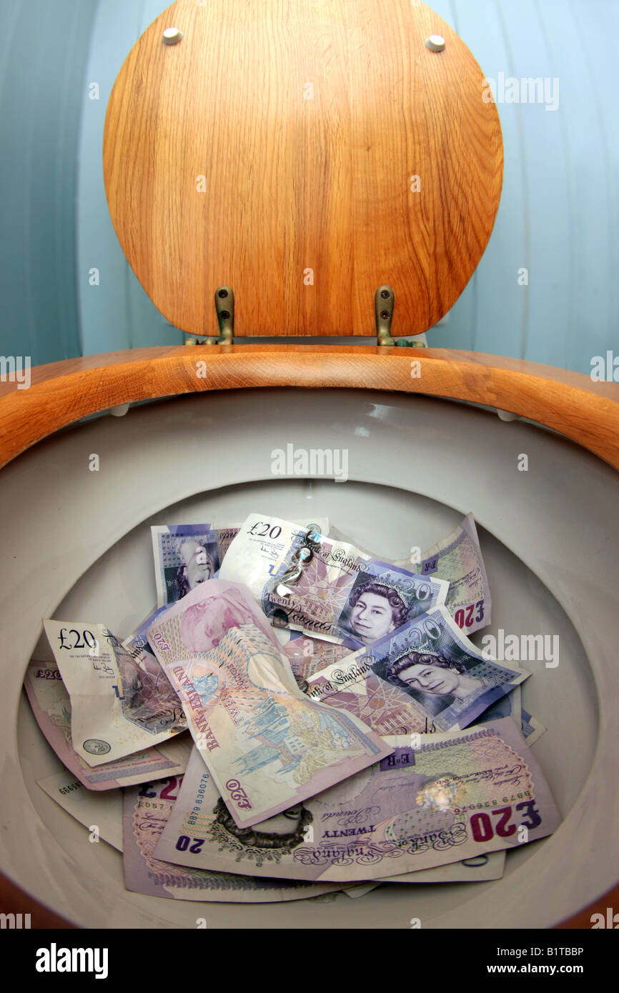 toilet full of 20 pounds notes Stock Photo Alamy