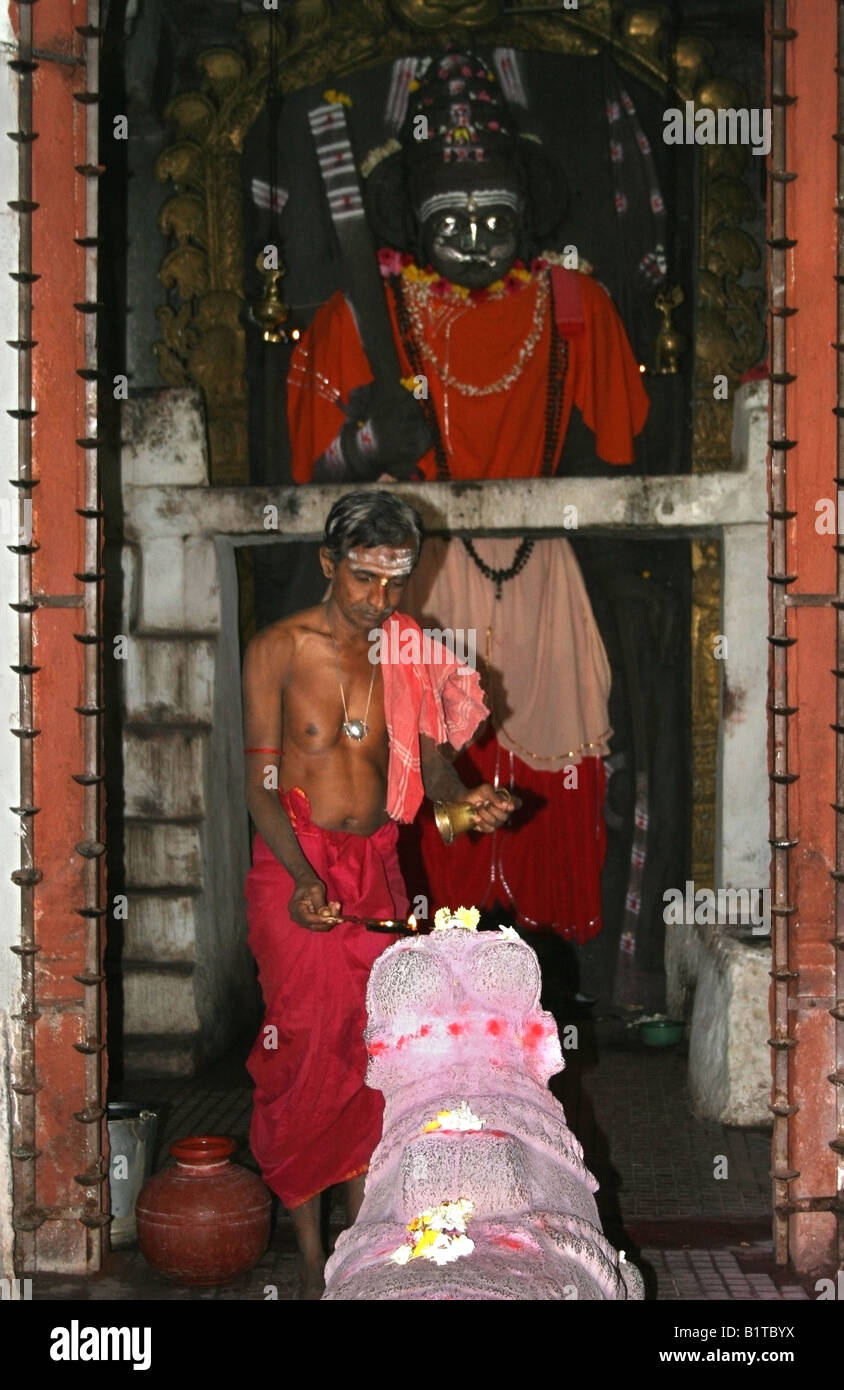 Priest offers pooja to a Nandi statue with a 16 foot Virabhadra idol