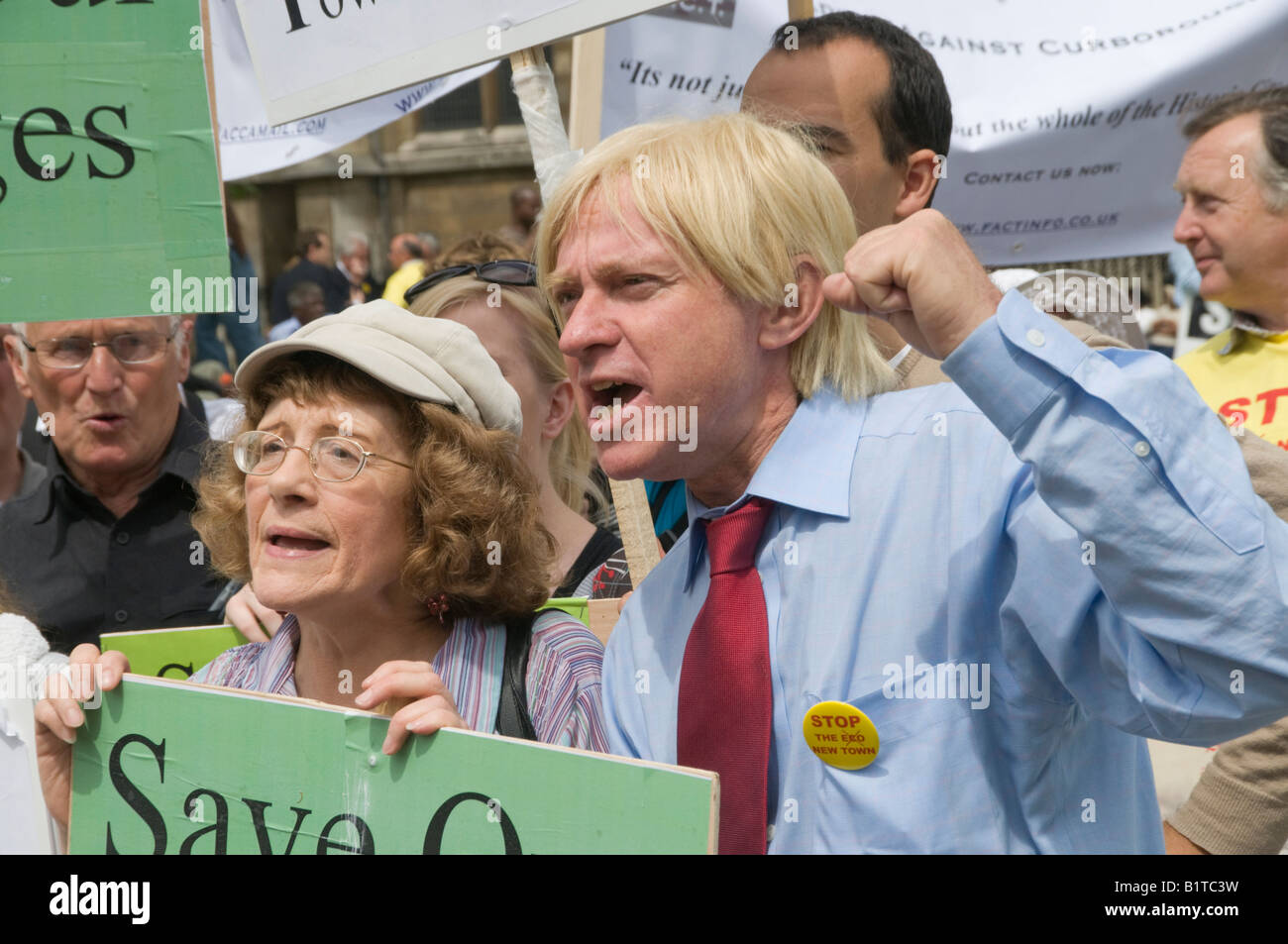 Michael Fabricant MP for Lichfield with protesters from Curborough outside the Houses of Parliament at eco-town lobby Stock Photo