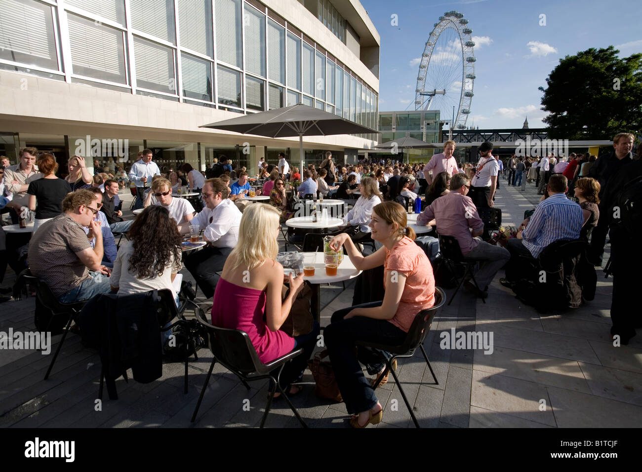 People sitting in the Bar terrace outside the Royal Festival Hall on a hot Summer day London England Britain UK Stock Photo